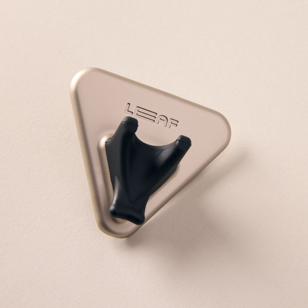 A silver razor shower holder